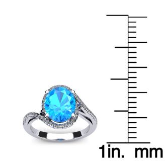 1 1/4 Carat Oval Shape Blue Topaz and Halo Diamond Ring In 14 Karat White Gold