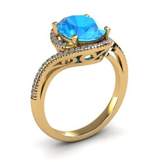 1 1/4 Carat Oval Shape Blue Topaz and Halo Diamond Ring In 14 Karat Yellow Gold