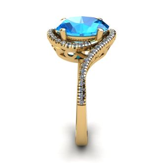 1 1/4 Carat Oval Shape Blue Topaz and Halo Diamond Ring In 14 Karat Yellow Gold