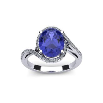 1 1/4 Carat Oval Shape Tanzanite and Halo Diamond Ring In 14 Karat White Gold
