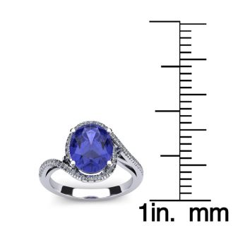 1 1/4 Carat Oval Shape Tanzanite and Halo Diamond Ring In 14 Karat White Gold