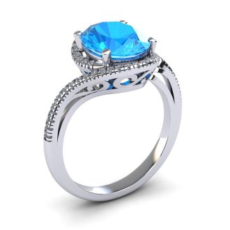 1 3/4 Carat Oval Shape Blue Topaz and Halo Diamond Ring In 14 Karat White Gold