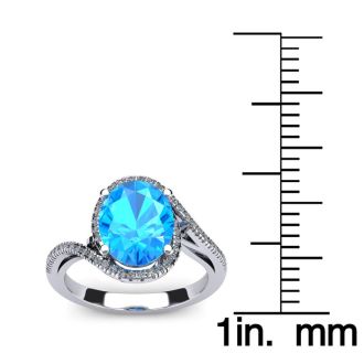 1 3/4 Carat Oval Shape Blue Topaz and Halo Diamond Ring In 14 Karat White Gold