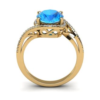 1 3/4 Carat Oval Shape Blue Topaz and Halo Diamond Ring In 14 Karat Yellow Gold