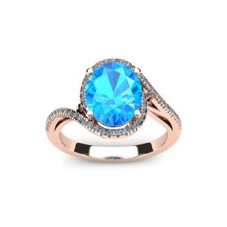 1 3/4 Carat Oval Shape Blue Topaz and Halo Diamond Ring In 14 Karat Rose Gold