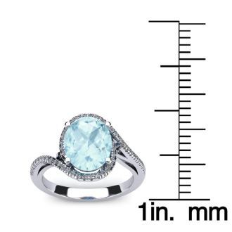 Aquamarine Ring: Aquamarine Jewelry: 1 1/3 Carat Oval Shape Aquamarine and Halo Diamond Ring In 14 Karat White Gold