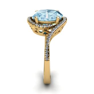 Aquamarine Ring: Aquamarine Jewelry: 1 1/3 Carat Oval Shape Aquamarine and Halo Diamond Ring In 14 Karat Yellow Gold