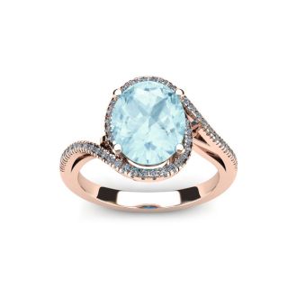 Aquamarine Ring: Aquamarine Jewelry: 1 1/3 Carat Oval Shape Aquamarine and Halo Diamond Ring In 14 Karat Rose Gold