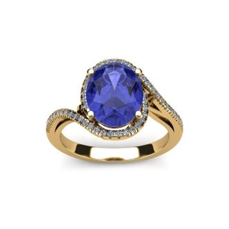 1 1/2 Carat Oval Shape Tanzanite and Halo Diamond Ring In 14 Karat Yellow Gold