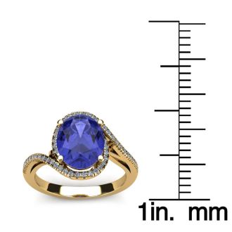 1 1/2 Carat Oval Shape Tanzanite and Halo Diamond Ring In 14 Karat Yellow Gold