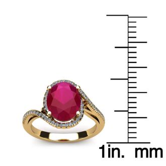 1 3/4 Carat Oval Shape Ruby and Halo Diamond Ring In 14 Karat Yellow Gold