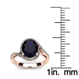 1 3/4 Carat Oval Shape Sapphire and Halo Diamond Ring In 14 Karat Rose Gold