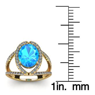 2 Carat Oval Shape Blue Topaz and Halo Diamond Ring In 14 Karat Yellow Gold