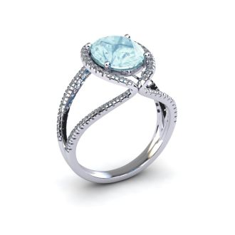Aquamarine Ring: Aquamarine Jewelry: 1 1/2 Carat Oval Shape Aquamarine and Halo Diamond Ring In 14 Karat White Gold

