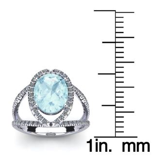Aquamarine Ring: Aquamarine Jewelry: 1 1/2 Carat Oval Shape Aquamarine and Halo Diamond Ring In 14 Karat White Gold
