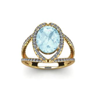 Aquamarine Ring: Aquamarine Jewelry: 1 1/2 Carat Oval Shape Aquamarine and Halo Diamond Ring In 14 Karat Yellow Gold
