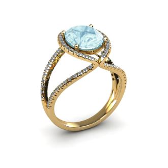 Aquamarine Ring: Aquamarine Jewelry: 1 1/2 Carat Oval Shape Aquamarine and Halo Diamond Ring In 14 Karat Yellow Gold
