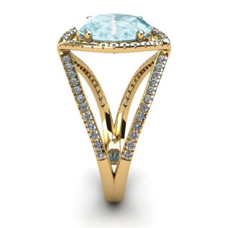 Aquamarine Ring: Aquamarine Jewelry: 1 1/2 Carat Oval Shape Aquamarine and Halo Diamond Ring In 14 Karat Yellow Gold
