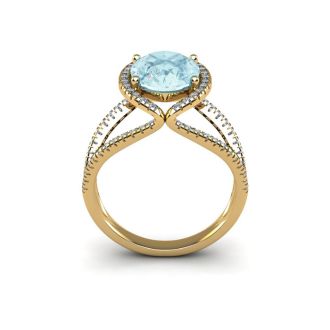Aquamarine Ring: Aquamarine Jewelry: 1 1/2 Carat Oval Shape Aquamarine and Halo Diamond Ring In 14 Karat Yellow Gold
