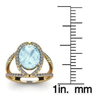 Aquamarine Ring: Aquamarine Jewelry: 1 1/2 Carat Oval Shape Aquamarine and Halo Diamond Ring In 14 Karat Yellow Gold
