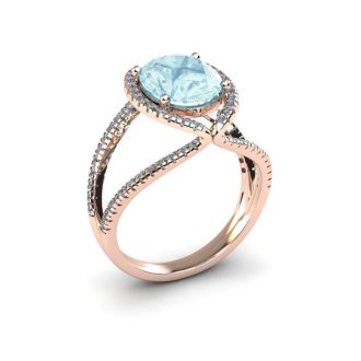 Aquamarine Ring: Aquamarine Jewelry: 1 1/2 Carat Oval Shape Aquamarine and Halo Diamond Ring In 14 Karat Rose Gold
