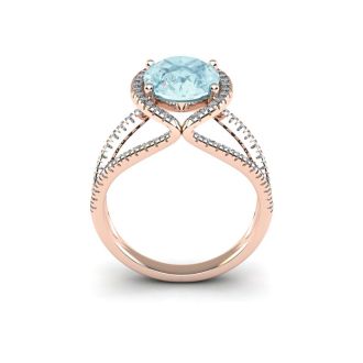 Aquamarine Ring: Aquamarine Jewelry: 1 1/2 Carat Oval Shape Aquamarine and Halo Diamond Ring In 14 Karat Rose Gold
