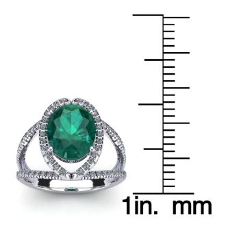 1 1/2 Carat Oval Shape Emerald and Halo Diamond Ring In 14 Karat White Gold

