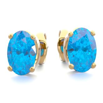 1 Carat Oval Shape Blue Topaz Stud Earrings In 14K Yellow Gold Over Sterling Silver