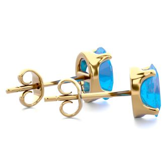 1 Carat Oval Shape Blue Topaz Stud Earrings In 14K Yellow Gold Over Sterling Silver