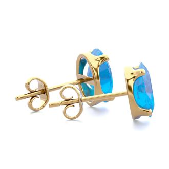2 Carat Oval Shape Blue Topaz Stud Earrings In 14K Yellow Gold Over Sterling Silver