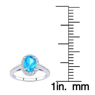 1 1/3 Carat Oval Shape Blue Topaz and Halo Diamond Ring In 14 Karat White Gold