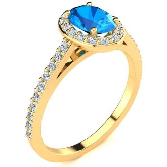 1 1/3 Carat Oval Shape Blue Topaz and Halo Diamond Ring In 14 Karat Yellow Gold