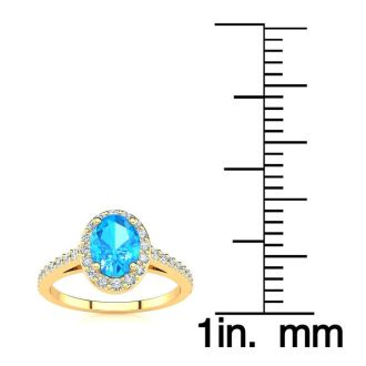 1 1/3 Carat Oval Shape Blue Topaz and Halo Diamond Ring In 14 Karat Yellow Gold