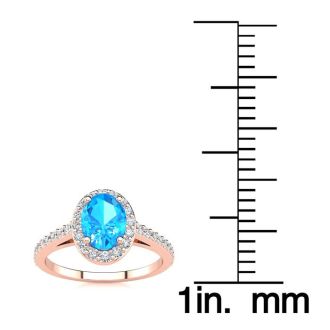 1 1/3 Carat Oval Shape Blue Topaz and Halo Diamond Ring In 14 Karat Rose Gold