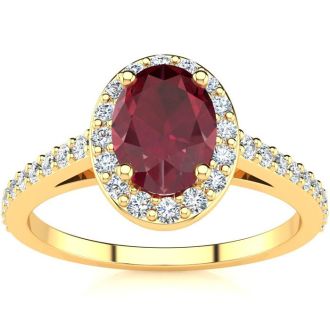 1 1/4 Carat Oval Shape Ruby and Halo Diamond Ring In 14 Karat Yellow Gold