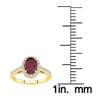 1 1/4 Carat Oval Shape Ruby and Halo Diamond Ring In 14 Karat Yellow Gold