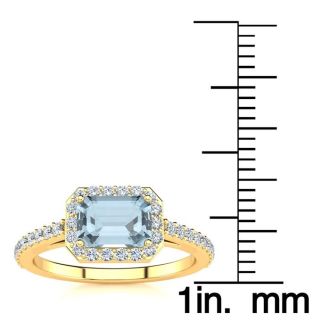 Aquamarine Ring: Aquamarine Jewelry: 1 1/4 Carat Aquamarine and Halo Diamond Ring In 14 Karat Yellow Gold
