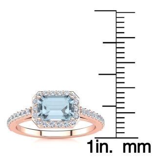 Aquamarine Ring: Aquamarine Jewelry: 1 1/4 Carat Aquamarine and Halo Diamond Ring In 14 Karat Rose Gold