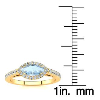 Aquamarine Ring: Aquamarine Jewelry: 3/4 Carat Marquise Shape Aquamarine and Halo Diamond Ring In 14 Karat Yellow Gold
