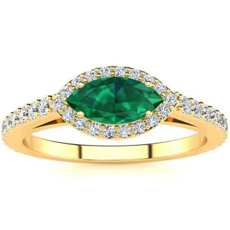 3/4 Carat Marquise Shape Emerald and Halo Diamond Ring In 14 Karat Yellow Gold