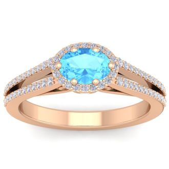 1 1/2 Carat Oval Shape Antique Blue Topaz and Halo Diamond Ring In 14 Karat Rose Gold
