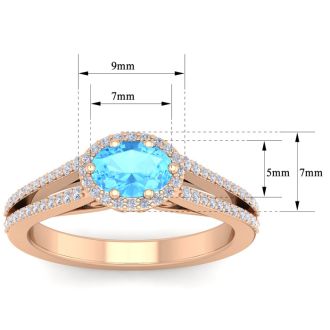 1 1/2 Carat Oval Shape Antique Blue Topaz and Halo Diamond Ring In 14 Karat Rose Gold