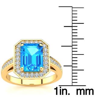 3 Carat Blue Topaz and Halo Diamond Ring In 14 Karat Yellow Gold