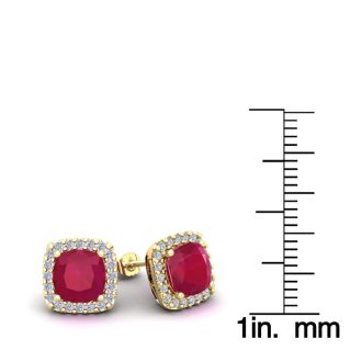 3 Carat Cushion Cut Ruby and Halo Diamond Stud Earrings In 14 Karat Yellow Gold