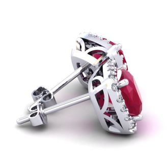 6 3/4 Carat Cushion Cut Ruby and Halo Diamond Stud Earrings In 14 Karat White Gold