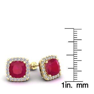 6 3/4 Carat Cushion Cut Ruby and Halo Diamond Stud Earrings In 14 Karat Yellow Gold