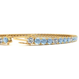 4 Carat Aquamarine And Diamond Graduated Tennis Bracelet In 14 Karat Yellow Gold, 7 Inches