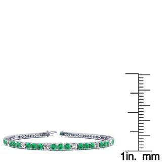 4 1/3 Carat Emerald And Diamond Graduated Tennis Bracelet In 14 Karat White Gold, 7 Inches