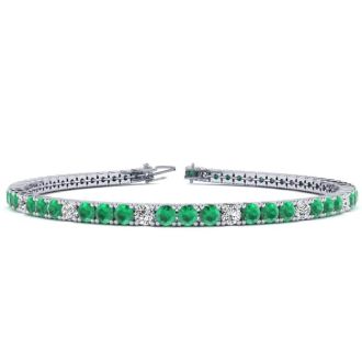 5 2/3 Carat Emerald And Diamond Graduated Tennis Bracelet In 14 Karat White Gold, 9 Inches