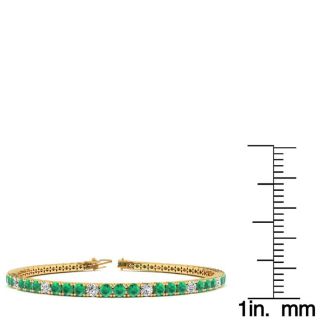 5 1/3 Carat Emerald And Diamond Graduated Tennis Bracelet In 14 Karat Yellow Gold, 8 1/2 Inches